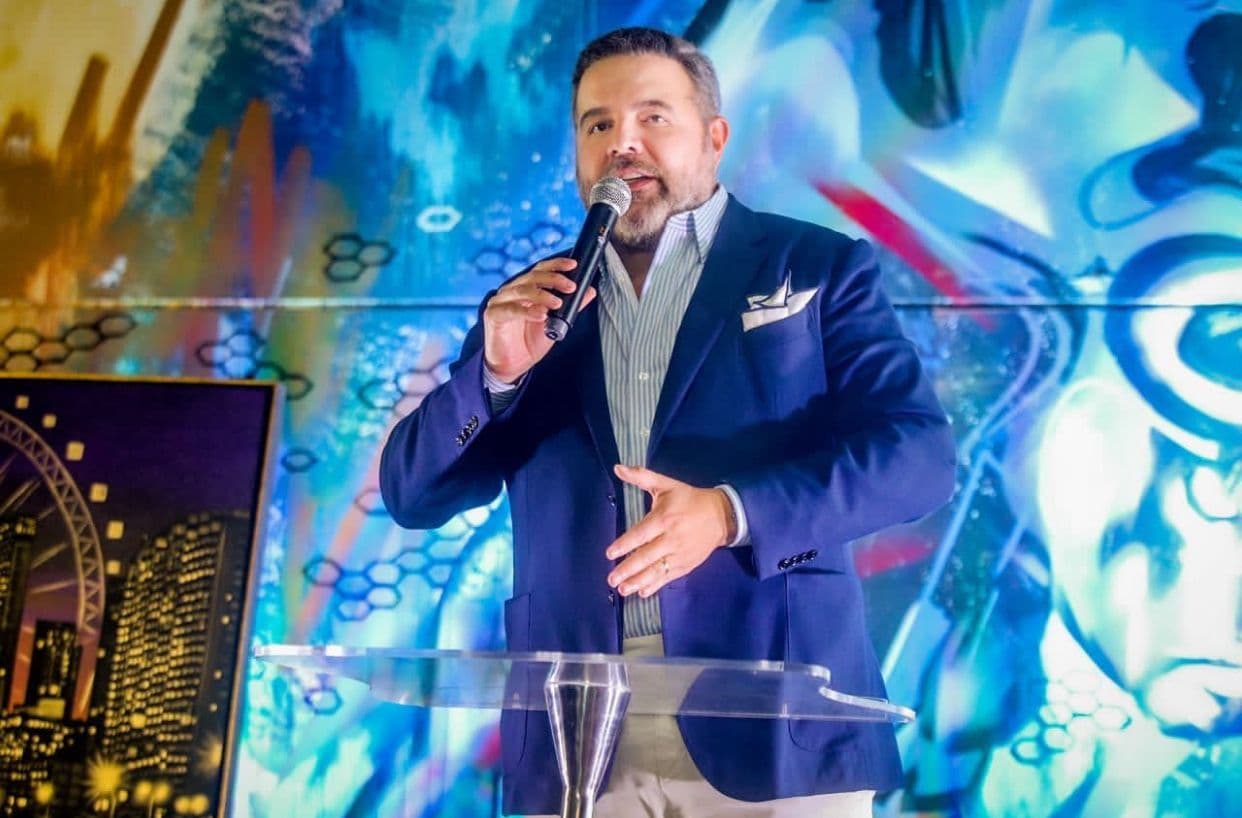 CEO Maria Chen accepting the award at the Thetius Innovation Summit